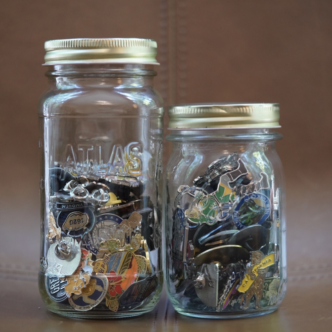 Enamel pins in jars